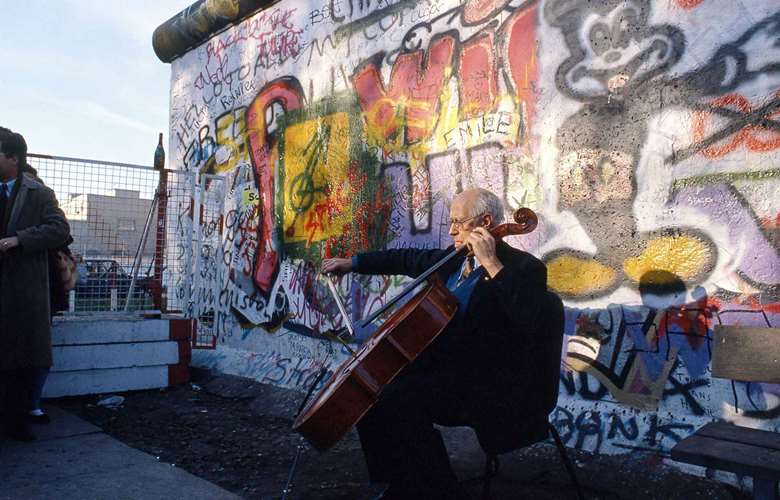 Mstislav Rostropovich playing Bach  in front of the Berlin Wall when it fell in 1989