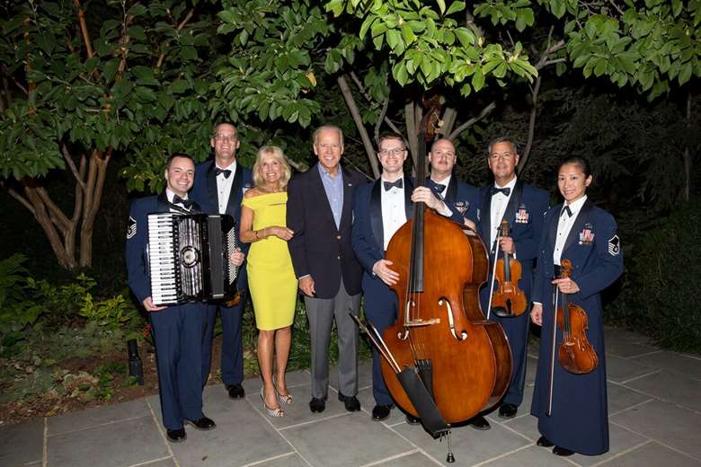 Joe and Jill Biden with members of the United States Air Force orchestra at the White House 