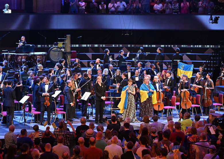 Pianist Anna Fedorova and soprano Liudmyla Monastyrska are draped in Ukrainin flags following their Prom 19a with the Ukranian Freedom Orchestra conducted by Keri-Lynn Wilson ©Mark Allan