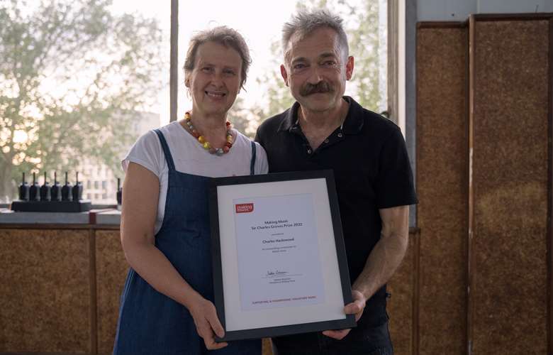 Making Music chief executive Barbara Eifler (left) presented Charles Hazlewood (right) with the prize at a special performance by the Paraorchestra (Image courtesy of Making Music)