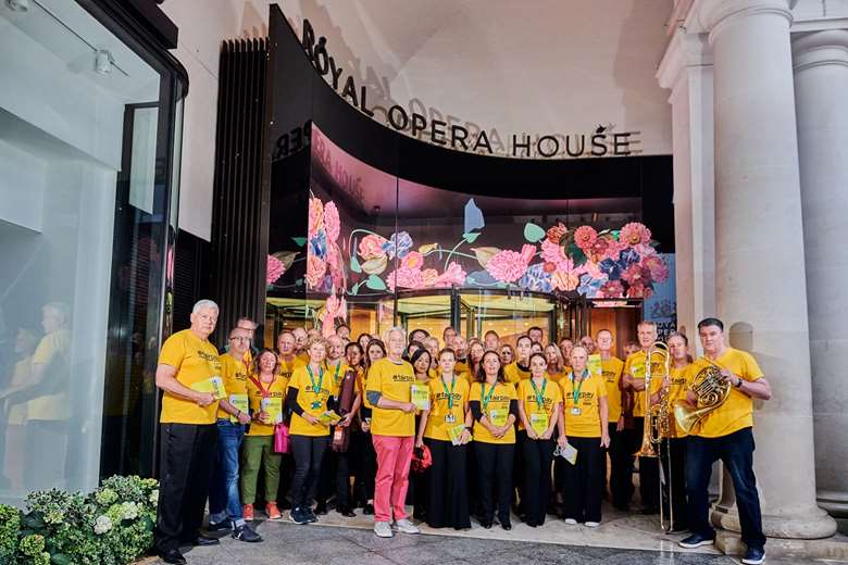 Members of the orchestra wore yellow ‘#FairPay’ t-shirts instead of their usual concert dress as part of a campaign to have their pay restored following a pay cut during the pandemic. © Jonathan Stewart